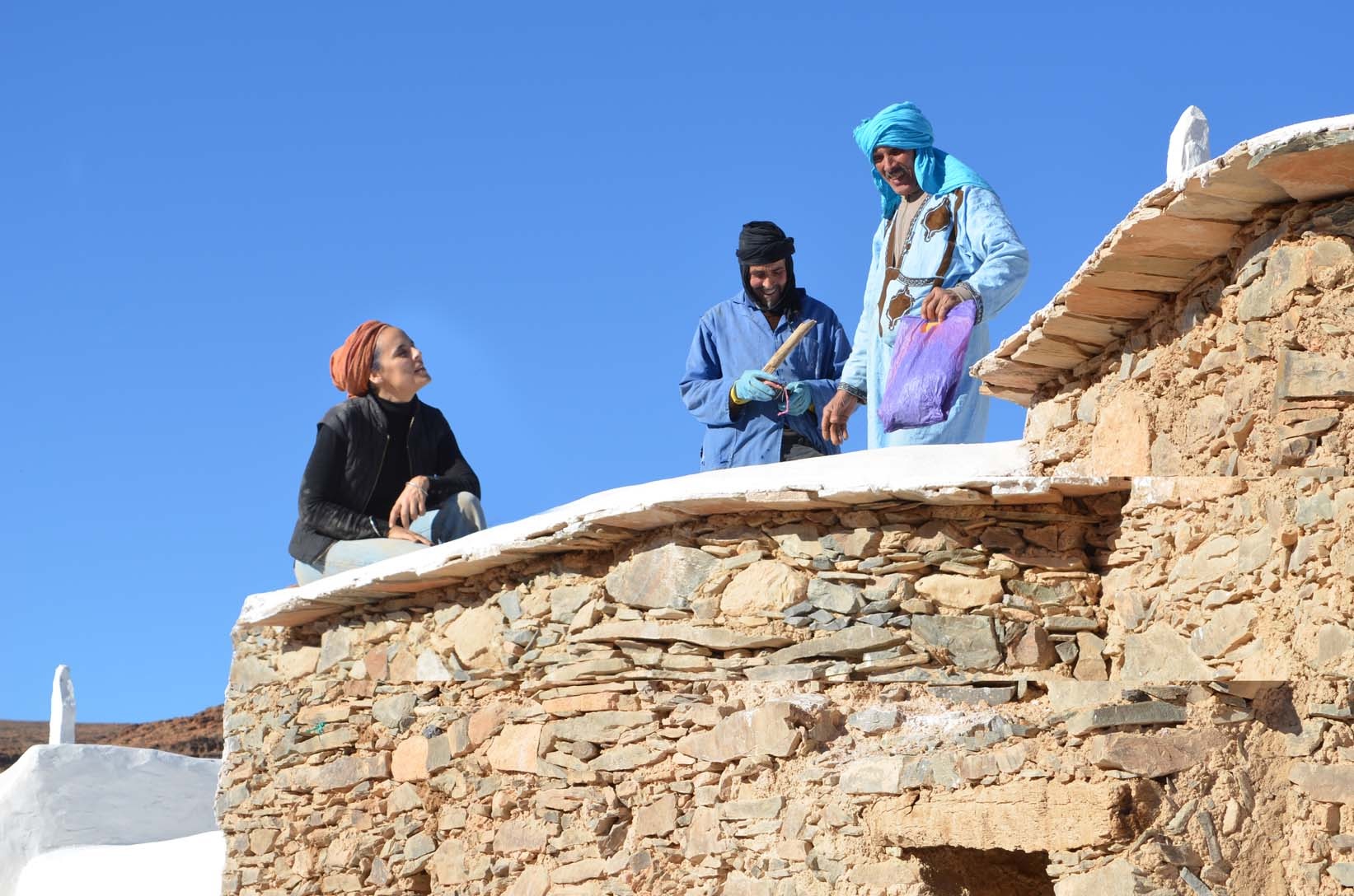 salima naji with workers at id aissa granary